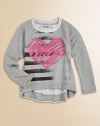 This vintage-inspired pullover with slightly tattered hi-lo hem and colorful heart print will make her pulse race.CrewneckLong raglan sleevesPullover styleHi-lo hem80% cotton/20% polyesterHand washImported