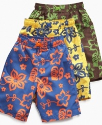 A tropical paradise. He'll get in the hot-weather spirit with a pair of these patterned swim trunks from Tommy Hilfiger. A tropical paradise. He'll get in the hot-weather spirit with a pair of these patterned swim trunks from Tommy Hilfiger.