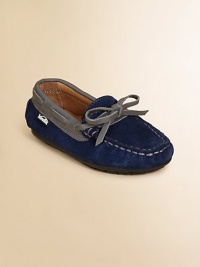 Comfortable classics he'll slip on and go, crafted of supple suede with adjustable bow across the vamp.Slip-onSuede upperLeather liningRubber solePadded insoleImported Comfortable classics he'll slip on and go, crafted of supple suede with adjustable bow across the vamp.Slip-onSuede upperLeather liningRubber solePadded insoleImported