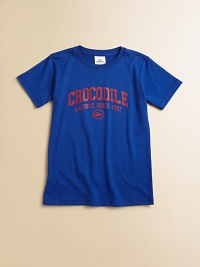 The familiar crocodile, emblazoned on the front of a simple tee, with an attitude that's pure Lacoste.Ribbed crewneckShort hemmed sleevesFront screenCottonMachine washImported The familiar crocodile, emblazoned on the front of a simple tee, with an attitude that's pure Lacoste.Ribbed crewneckShort hemmed sleevesFront screenCottonMachine washImported