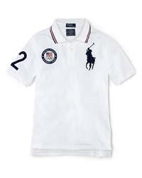 A preppy short-sleeved polo shirt in breathable cotton mesh is accented with London embroidery and a US Olympic Team embroidered emblem, celebrating Team USA's participation in the 2012 Olympics. A preppy short-sleeved polo shirt in breathable cotton mesh is accented with London embroidery and a US Olympic Team embroidered emblem, celebrating Team USA's participation in the 2012 Olympics.