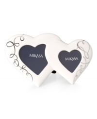 Two hearts become one in this ultra-sweet Love Story picture frame. Featuring ribbons of platinum in sculpted white porcelain from Mikasa. Two hearts become one in this ultra-sweet Love Story picture frame. Featuring ribbons of platinum in sculpted white porcelain from Mikasa.