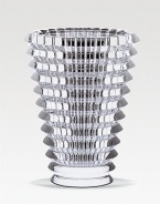A multi-faceted vase is beautifully handcrafted in France with dynamic texture that captures and accentuates the light in any room. From the Eye Collection Full-lead crystal 5¾ high Hand wash Made in France 