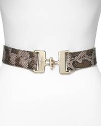 Add an exotic tough to every look with this python-embossed belt from Cole Haan. This style features elastic stretch -- wear it over chunky knits or to enliven a basic day dress. Add an exotic tough to every look with this python-embossed belt from Cole Haan. This style features elastic stretch -- wear it over chunky knits or to enliven a basic day dress.