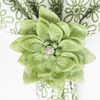 The natural form of a blooming dahlia is artfully captured in this textural napkin ring from Juliska. It's finished with a touch of sparkle at the center. The natural form of a blooming dahlia is artfully captured in this textural napkin ring from Juliska. It's finished with a touch of sparkle at the center.