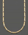 Simple style with a touch of the exotic. This bamboo necklace is crafted in 14k gold and sterling silver over sterling silver. Approximate length: 16 inches.