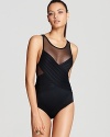 To reveal or conceal? Toe the line with Carmen Marc Valvo's one piece swimsuit with sophisticated sheer paneling.