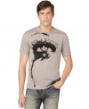 A cool graphic of an eye with a skull pupil and trance printed above, gives this Calvin Klein Jeans tee its edgy artsy style.