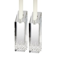 Updated with striking shapes, these candlesticks retain the classic details of the iconic Waterford Lismore pattern for an alluring display of crystal and candlelight. Updated with striking shapes, these candlesticks retain the classic details of the iconic Waterford Lismore pattern for an alluring display of crystal and candlelight.