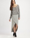 Stretchy, faux-wrap design has an elastic waistband and alluring leg-baring front. Elastic waistbandAsymmetrical crossover hemAbout 38 long84% rayon/9% polyester/7% spandexDry cleanMade in USAModel shown is 5'9½ (176cm) wearing US size 4.