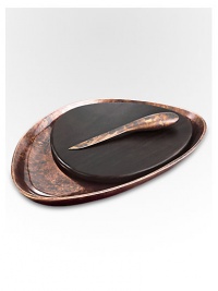 A smooth, rounded pebble shape with the distinctive beauty of bronze-finish alloy and wood creates the ultimate hostess or wedding gift. From the Heritage Pebble CollectionIncludes cheese knifeAntique copper-plated alloy15W x 11LHand washImported