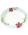 Painterly lilies bloom around this porcelain oval platter, creating a beautiful arrangement with the rest of Oleg Cassini's Sweet Blossom dinnerware.