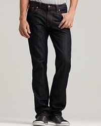 Five pocket slim, straight leg jeans. Dry, clean denim from Italy with no fading or distressing. Nudie orange threads all over and orange back pocket embroidery. Button fly. Five pocket slim, straight leg jeans. Dry, clean denim from Italy with no fading or distressing. Nudie orange threads all over and orange back pocket embroidery. Button fly.