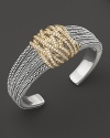 Diamonds in 18K yellow gold wrap around this sterling silver statement cuff from Lagos.