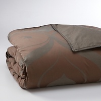 Stylish and elegant, Cartouche is a modern variation on a classical design. Oversized scroll motifs arc gracefully across the surface, while a subtle bark texture in pewter adds dimension to the chocolate sateen ground. Stylish and elegant, Cartouche is a modern variation on a classical design. Oversized scroll motifs arc gracefully across the surface, while a subtle bark texture in pewter adds dimension to the chocolate sateen ground.