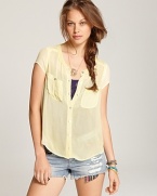 High on hue, this neon Free People top makes a haute impact with a sheer texture and oversized silhouette. Balance the look with spray-on denim and a towering heel.