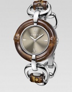From the Bamboo Collection. This nature-inspired style features beautiful bamboo details mixed with sleek stainless steel. Swiss quartz movementWater resistant to 3 ATMRound stainless steel case, 35mm (1.4) Bamboo accented bezelBrown sun-brushed dialBar and Roman numeral hour markers at 3, 6, 9 and 12Bamboo accented stainless steel bangleMade in Switzerland Please note: Bamboo accents are not water resistant.