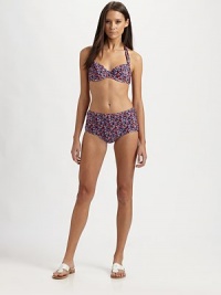 A retro-inspired, muted floral design with a stretch bottom enhanced by a clever back zipper-ribbon-tie combo.Halter strap ties at neckBack claspFull coverage bottom76% nylon/24% spandexHand washMade in USA of Italian fabric A retro-inspired, muted floral design with a stretch bottom enhanced by a clever back zipper-ribbon-tie combo.Halter strap ties at neckBack claspFull coverage bottom76% nylon/24% spandexHand washMade in USA of Italian fabric