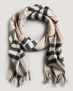 Stay warm in style with this luxe cashmere scarf from Burberry.
