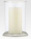 Gleaming glass and polished nickel is crafted to house a single pillar candle for a beautiful, ethereal effect. 8H X 5¾ diam.Glass and nickelImported