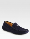 Suede moccasin with metal logo detail. Leather lining Padded insole Rubber sole Made in Italy 