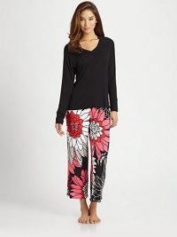 Incomparable comfort in a vibrant mix of soft solid and bold floral print, perfect for relaxation.Solid V-neck topLong raglan sleevesPrint pantsElastic waistInseam, about 25Rayon/spandexMachine washImported Incomparable comfort in a vibrant mix of soft solid and bold floral print, perfect for relaxation.Solid V-neck topLong raglan sleevesPrint pantsElastic waistInseam, about 25Rayon/spandexMachine washImported