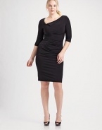 A seductive stretch silhouette with asymmetrical neckline, three-quarter sleeves and figure-flattering shirring.Concealed back zip About 25 from natural waist 92% polyester/8% spandex Dry clean Made in USA