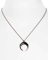 A gunmetal plated horn defines a simply styled silver link chain on a powerful Rebecca Minkoff pendant necklace. A gunmetal plated horn defines a simply styled silver link chain on a powerful Rebecca Minkoff pendant necklace.