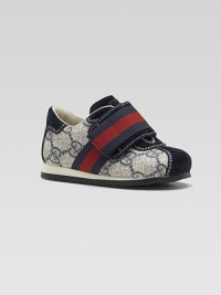 The famed stripes and double G fabric come together in a super sneaker with elegant suede accents.GG fabric upperSuede toe, back and accentsWide, striped grip-tape close strapRubber soleMade in Italy The famed stripes and double G fabric come together in a super sneaker with elegant suede accents.GG fabric upperSuede toe, back and accentsWide, striped grip-tape close strapRubber soleMade in Italy
