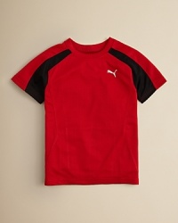 A solid sporty look from PUMA, this lightweight performance tee is crafted in a polyester knit designed to wick moisture away from the body. A solid sporty look from PUMA, this lightweight performance tee is crafted in a polyester knit designed to wick moisture away from the body.