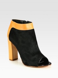 Peep toe silhouette of luxe pony hair, with a contrasting leather block heel and patent leather trim. Self-covered leather heel, 4 (100mm)Pony hair and leather upper with patent leather trimPeep toeSide zipperLeather lining and solePadded insoleMade in ItalyOUR FIT MODEL RECOMMENDS ordering one half size up as this style runs small. Peep toe silhouette of luxe pony hair, with a contrasting leather block heel and patent leather trim. Self-covered leather heel, 4 (100mm)Pony hair and leather upper with patent leather trimPeep toeSide zipperLeather lining and solePadded insoleMade in ItalyOUR FIT MODEL RECOMMENDS ordering one half size up as this style runs small.