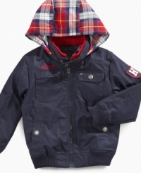 When the cold sets in, bundle him up in the crisp style of this hooded jacket from Tommy Hilfiger. When the cold sets in, bundle him up in the crisp style of this hooded jacket from Tommy Hilfiger.