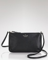 kate spade new york makes it chic to downsize with this black leather crossbody. Its sleek design and slim profile are a must for a night out on the town.