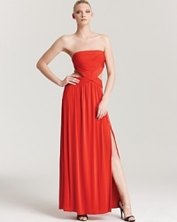 An intricately pleated bodice adds detailed interest to this potently hued BCBGMAXAZRIA gown, featuring side cutouts for a sultry hint of skin. An intricately pleated bodice adds detailed interest to this potently hued BCBGMAXAZRIA gown, featuring side cutouts for a sultry hint of skin.