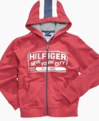 Racing stripe cool. This hoodie from Tommy Hilfiger will give his look a sleek style. Racing stripe cool. This hoodie from Tommy Hilfiger will give his look a sleek style.