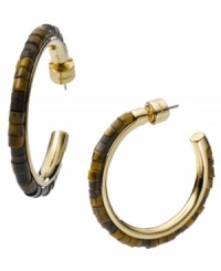 Tortoise shell hues aren't just for sunglasses anymore! Michael Kors puts the cool back into hoops with this updated style. A three-quarter hoop features intricate acrylic beading in tortoise shell hues. Set in gold tone mixed metal. Approximate diameter: 1-1/4 inches. Approximate width: 1/8 inch. Tortoise shell hues aren't just for sunglasses anymore! Michael Kors puts the cool back into hoops with this updated style. A three-quarter hoop features intricate acrylic beading in tortoise shell hues. Set in gold tone mixed metal. Approximate diameter: 1-1/4 inches. Approximate width: 1/8 inch.