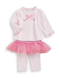 THE LOOKContrast picot trim at crewneck and tiered cuffsLong sleevesRibbon appliqué and rosette detail at frontBack snapsElastic waist knit leggings with attached tutu skirtTHE MATERIALCotton exclusive of decorationCARE & ORIGINMachine washImported THE LOOKContrast picot trim at crewneck and tiered cuffsLong sleevesRibbon appliqué and rosette detail at frontBack snapsElastic waist knit leggings with attached tutu skirtTHE MATERIALCotton exclusive of decorationCARE & ORIGINMachine washImported