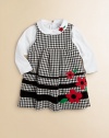 A must-have for your little girl, this cute check jumper features bold flowers and contrasting stripes.ScoopneckSleevelessBack zipperPolyesterMachine washImported
