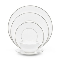 Jasper Conran continues to close the gap between formal dining and casual living. He accents the contemporary beauty of his already popular white bone china range with a touch of formality in the forum of a thin platinum band. To create an interplay of proportions, accent pieces including a plate, a charger, a small pitcher, mug, teacup and saucer, use thick platinum stripes to reinforce the pattern's look of sophisticated elegance.