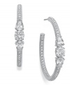Classic hoops with glistening glam. Eliot Danori's large hoop earrings feature pave-cut crystal accents and cubic zirconia (2-1/5 ct. t.w.) crafted from rhodium-plated tone mixed metal. Approximate diameter: 1-1/4 inch.