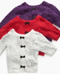 Bow accents amp up this fun girlie sweater from Jessica Simpson. Bow accents amp up this fun girlie sweater from Jessica Simpson.