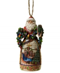 Christmas comes early in the elaborate carved skirt of Jim Shore's Deck the Halls Santa ornament. A picture-perfect holiday morning is topped with St. Nick, his arms full of colorful garland. Christmas comes early in the elaborate carved skirt of Jim Shore's Deck the Halls Santa ornament. A picture-perfect holiday morning is topped with St. Nick, his arms full of colorful garland.