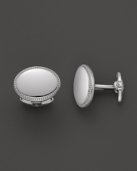 These classic sterling silver cuff links from Dolan & Bullock feature engravable space and a subtle pattern. From the Sterling Silver Engravables Collection. These classic sterling silver cuff links from Dolan & Bullock feature engravable space and a subtle pattern. From the Sterling Silver Engravables Collection.