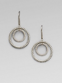 A circle of cabled sterling silver surrounds a sparkling pavé diamond-encrusted inner loop in these dangling earrings with a mobile-like design. Diamonds, 0.31 tcw Sterling silver Drop, about ¾ Ear wire Imported