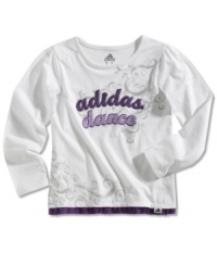 For the creative little girl, this long sleeve t-shirt by adidas is artistically styled with peaceful graphics. For the creative little girl, this long sleeve t-shirt by adidas is artistically styled with peaceful graphics.