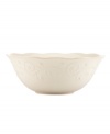 With fanciful beading and a feminine edge, this serving bowl from the Lenox French Perle white dinnerware collection has an irresistibly old-fashioned sensibility. Hard-wearing stoneware is dishwasher safe and, in a soft white hue with antiqued trim, a graceful addition to every meal.