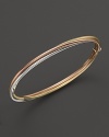 A classic bangle in 18K yellow, rose and white golds. From Roberto Coin.