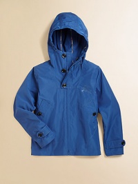 This packable, casual, lightweight layer with attached hood is sure to keep your child warm and dry.Attached hoodLong sleeves with button cuffsZip-front with buttoned bibFront patch pockets with button closurePolyesterMachine washImported Please note: Number of buttons may vary depending on size ordered. 