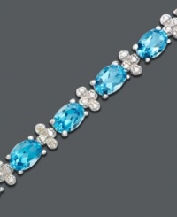 Caribbean cool color to brighten any day or night. Oval-cut blue topaz (14-1/2 ct. t.w.) and diamond accents sparkle like the ocean in this bracelet crafted in sterling silver. Approximate length: 7 inches. Caribbean cool color to brighten any day or night. Oval-cut blue topaz (14-1/2 ct. t.w.) and diamond accents sparkle like the ocean in this bracelet crafted in sterling silver. Approximate length: 7 inches.