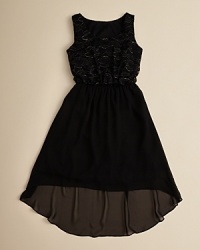 A lacy top is finished with a flowing chiffon skirt, creating a complete look for party season and beyond. A lacy top is finished with a flowing chiffon skirt, creating a complete look for party season and beyond.